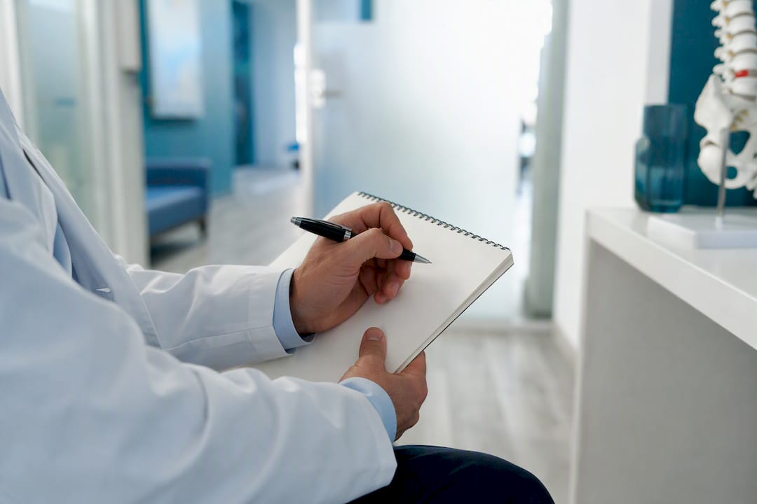 Radiologist reviewing diagnostic discrepancy documents